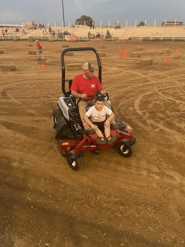 David E and grandson after-race clean-up