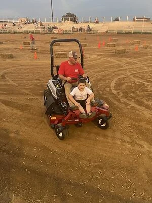 David E and grandson after-race clean-up